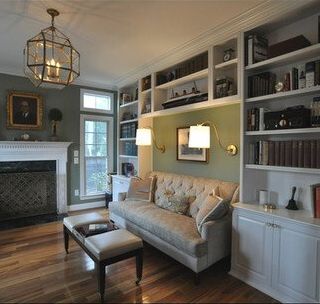 A living room with a couch and a fireplace