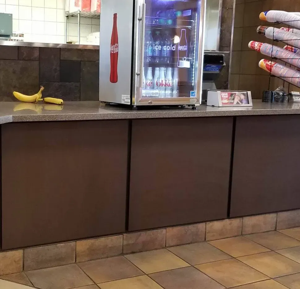 A counter with a coca cola bottle on it