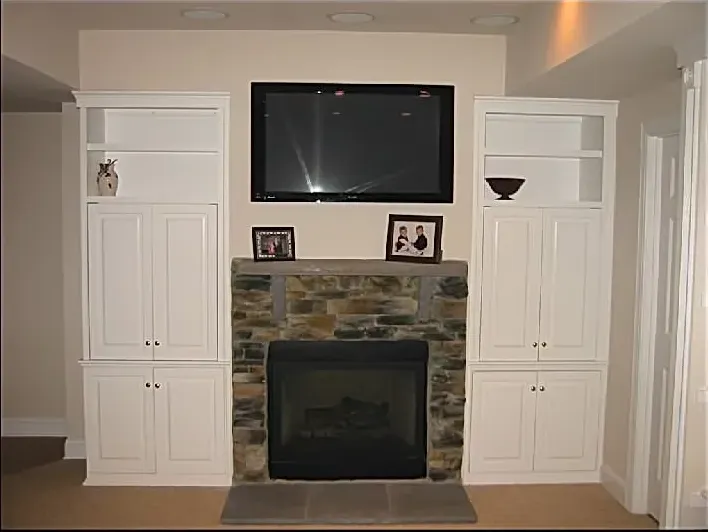 A fireplace with a flat screen tv above it