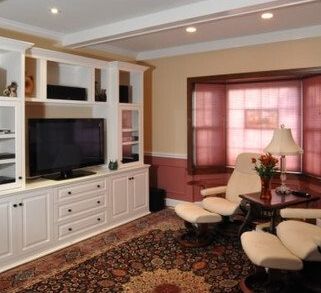 A living room filled with furniture and a flat screen tv