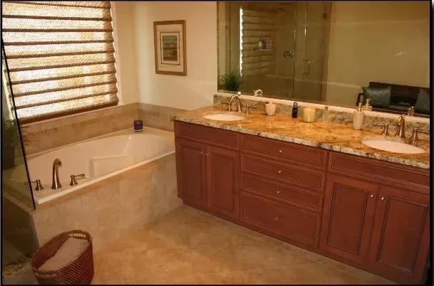 A bathroom with two sinks and a bathtub