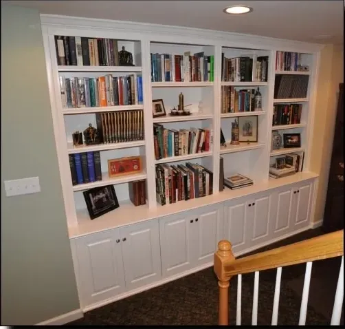 A bookshelf with a picture of a woman on it