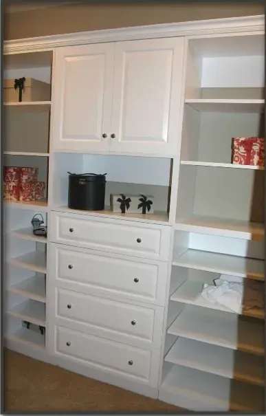 A closet with lots of shelves and drawers