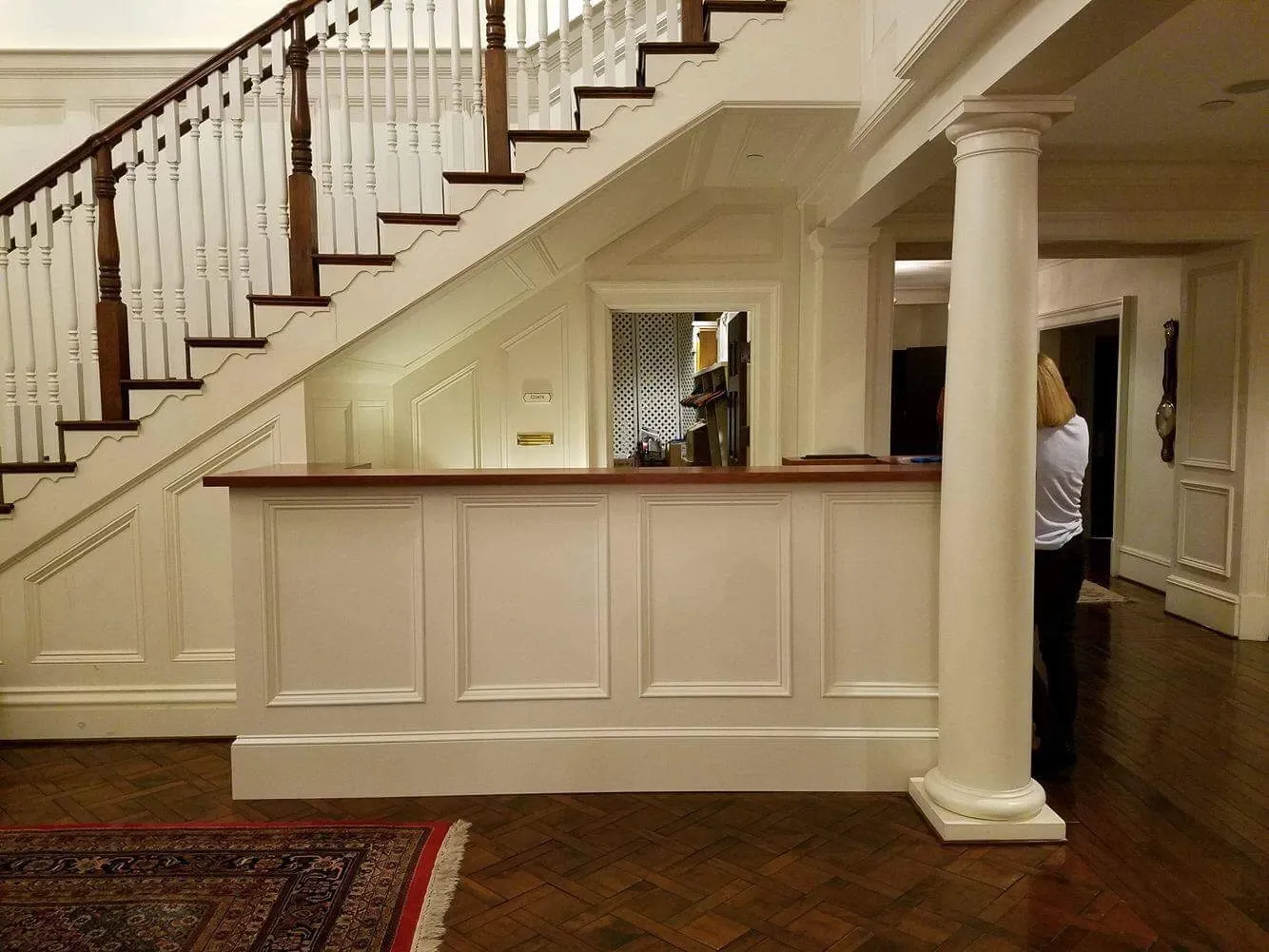 A staircase with a counter underneath it