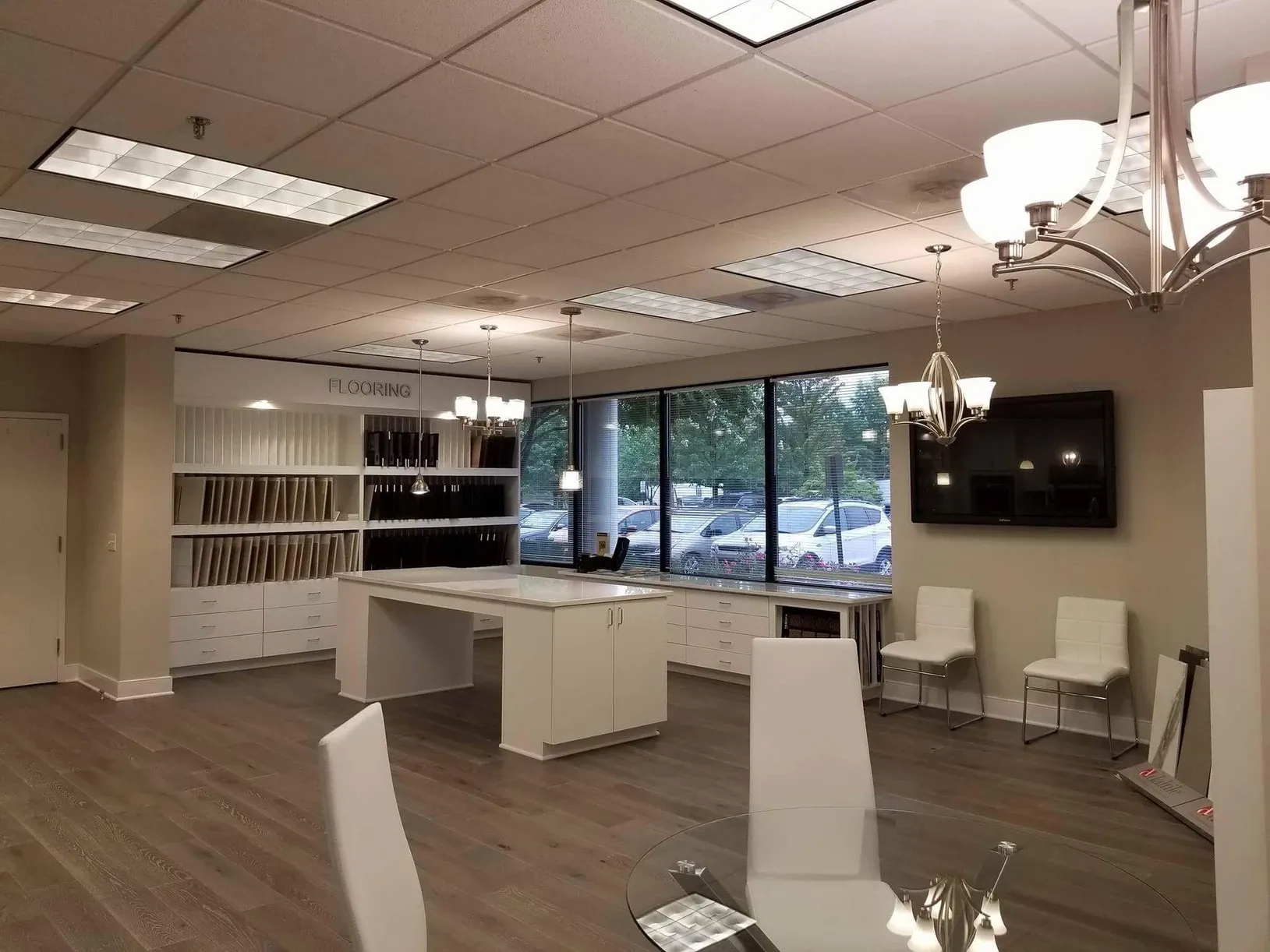 A large room with a table and chairs in it