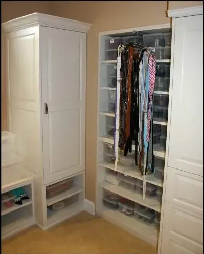 A closet filled with lots of ties and belts
