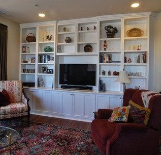 A living room filled with furniture and a flat screen tv.