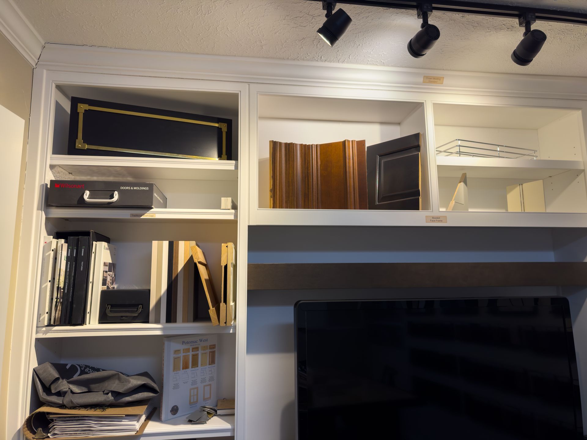 A tv is sitting on a shelf in a room