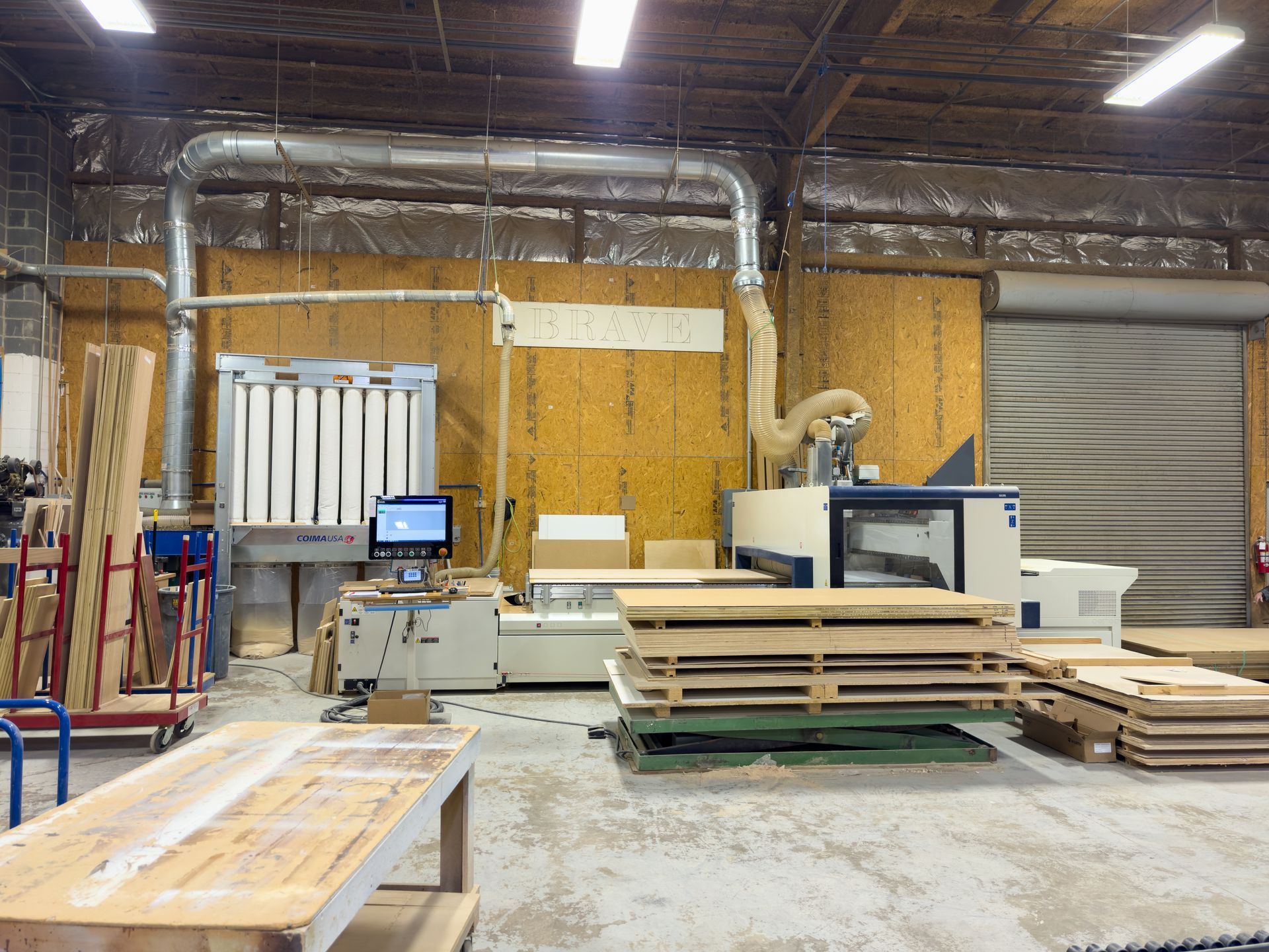 A warehouse filled with lots of wood and machinery