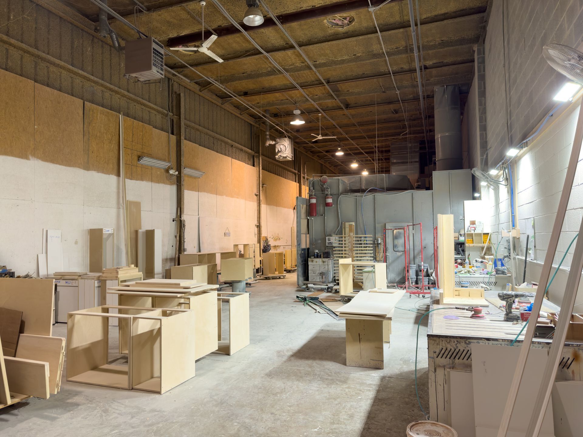 A large warehouse filled with lots of wooden pieces