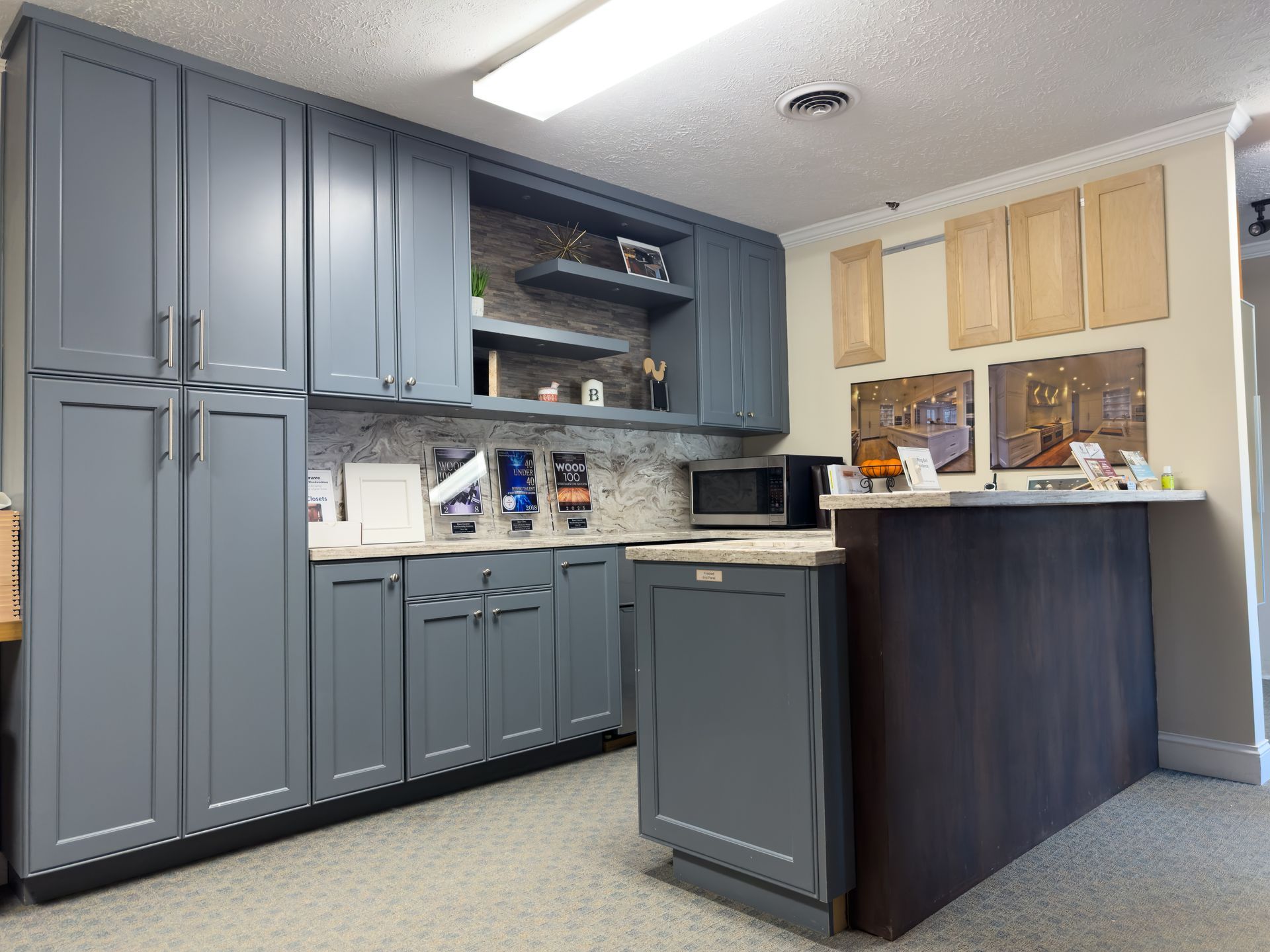 A kitchen with gray cabinets and a counter