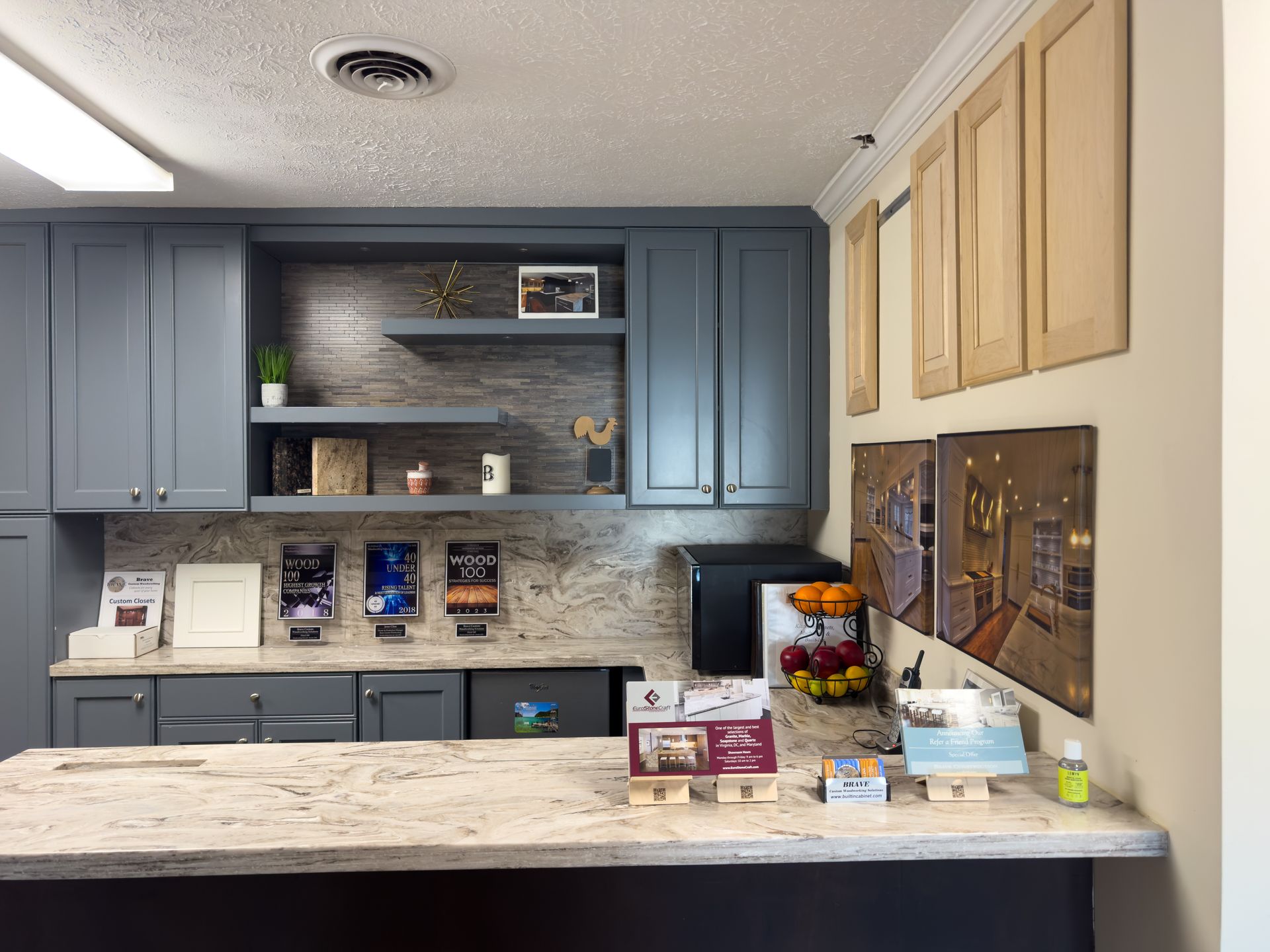 A kitchen with blue cabinets and granite counter tops
