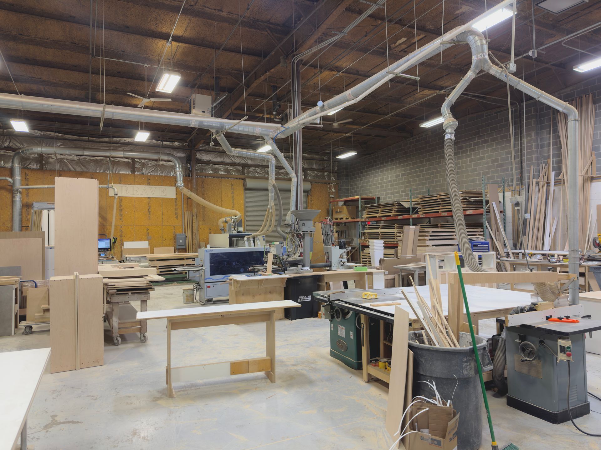 A warehouse filled with lots of wood and machinery