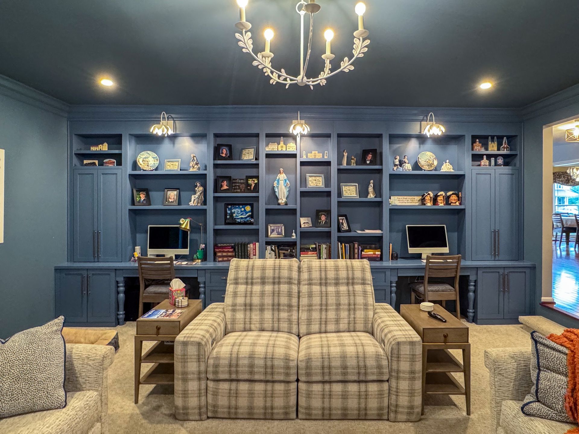 A living room with a couch and lots of shelves