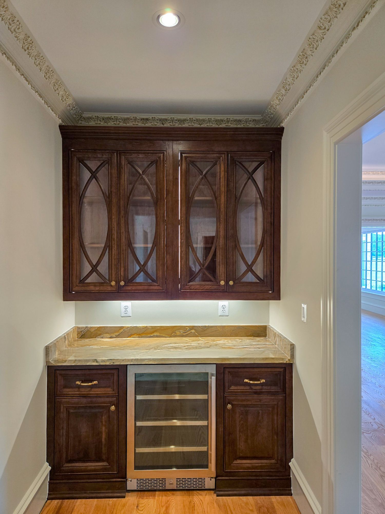 A kitchen with blue cabinets and wooden floors