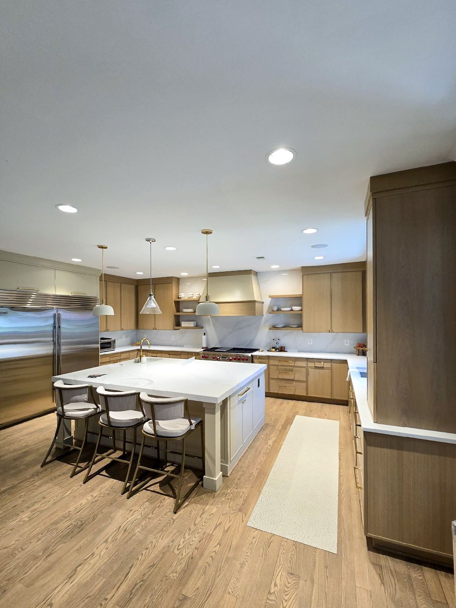 A kitchen with stainless steel appliances and wooden cabinets
