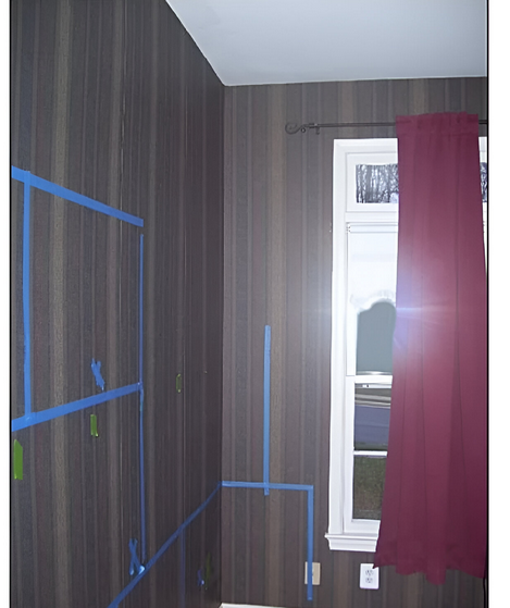 A room with a window and a red curtain