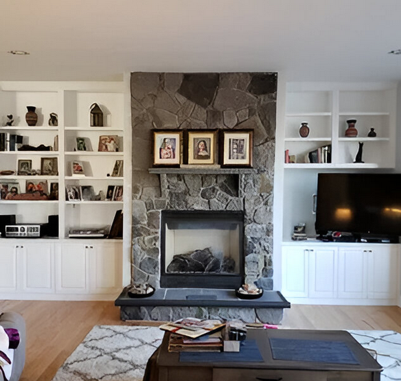 A living room with a fireplace and a flat screen tv