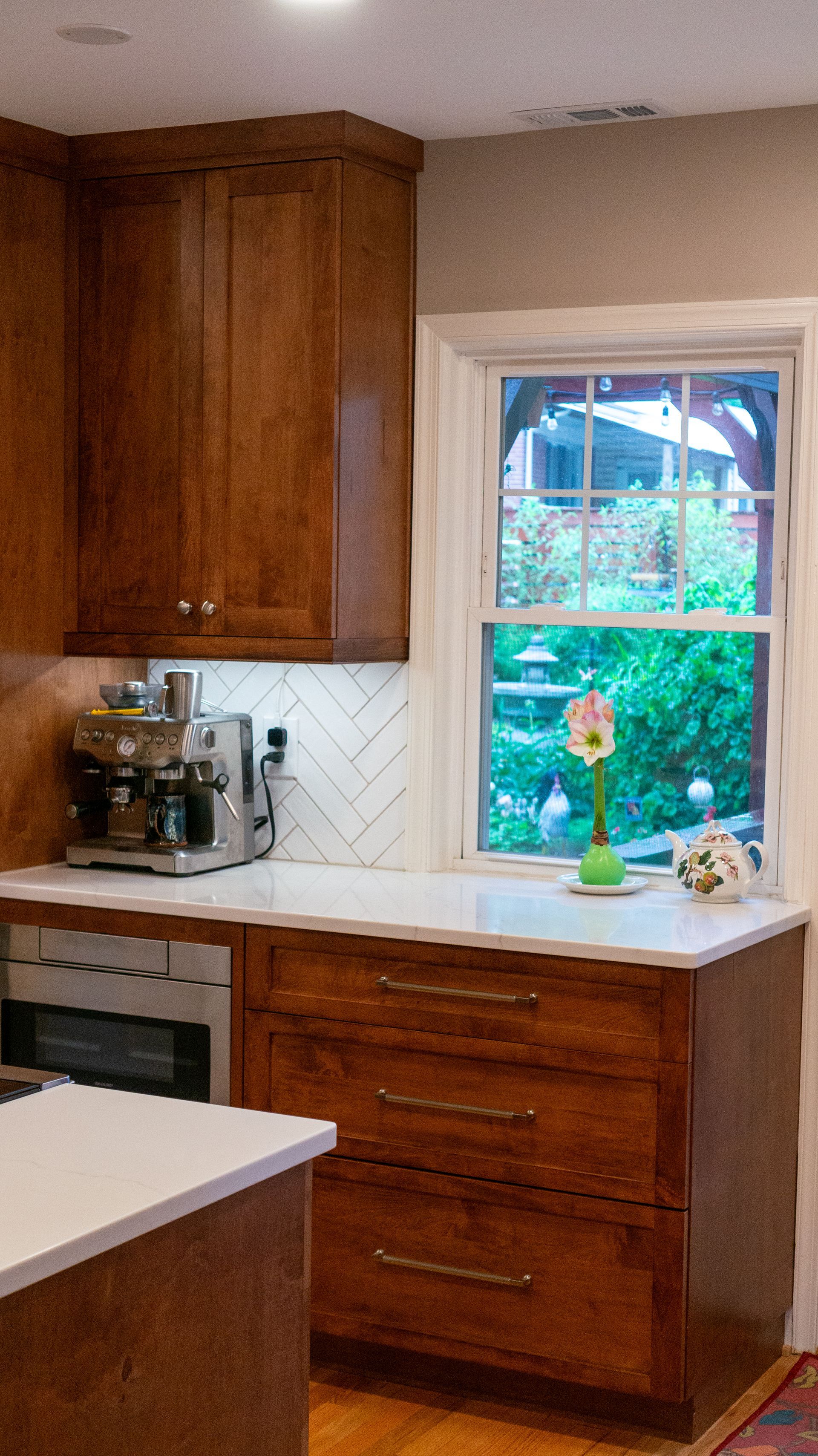 A kitchen with stainless steel appliances and wooden cabinets