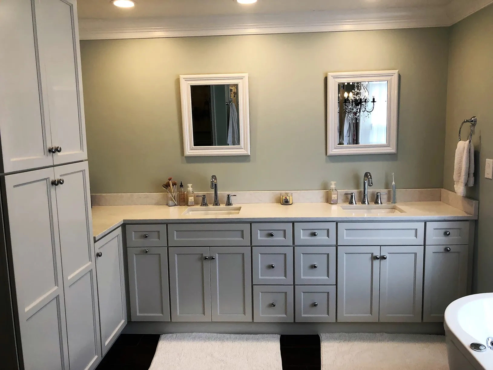 A bathroom with two sinks and two mirrors