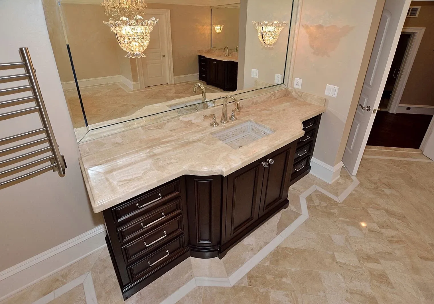 A bathroom with two sinks and a large mirror