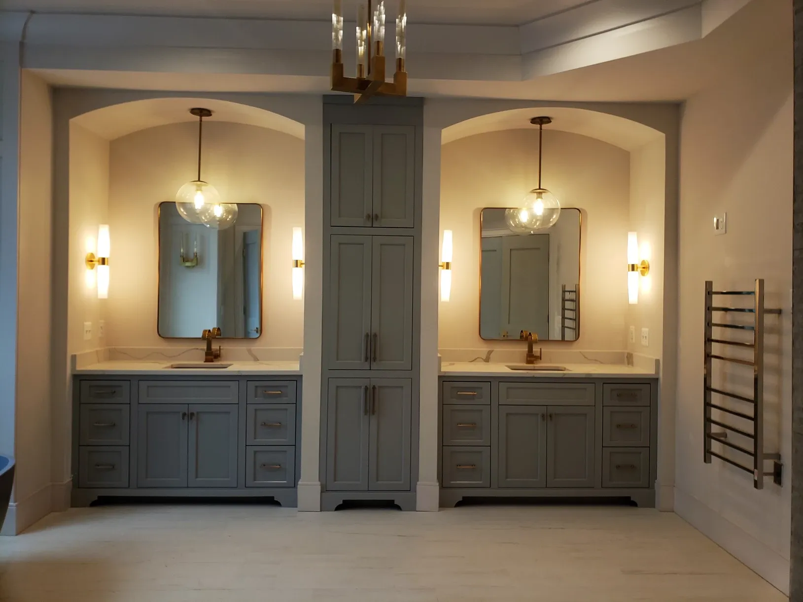 A bathroom with two sinks and two mirrors