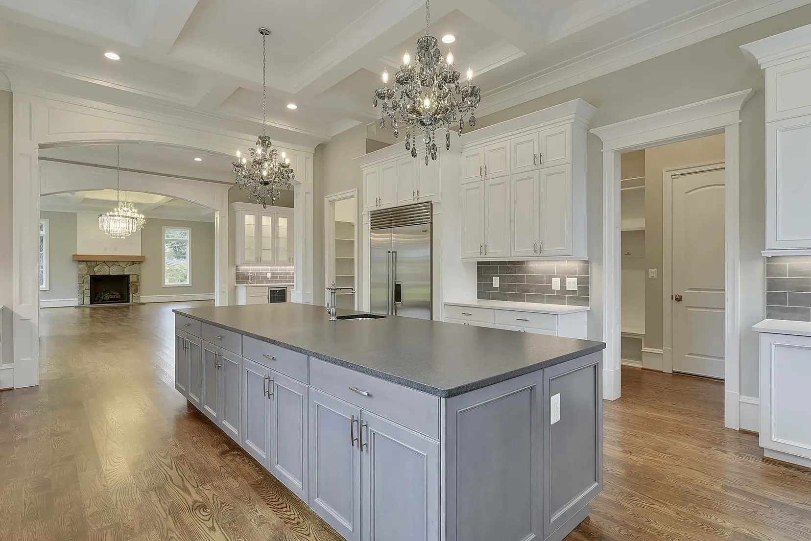 A large kitchen with a large island in the middle