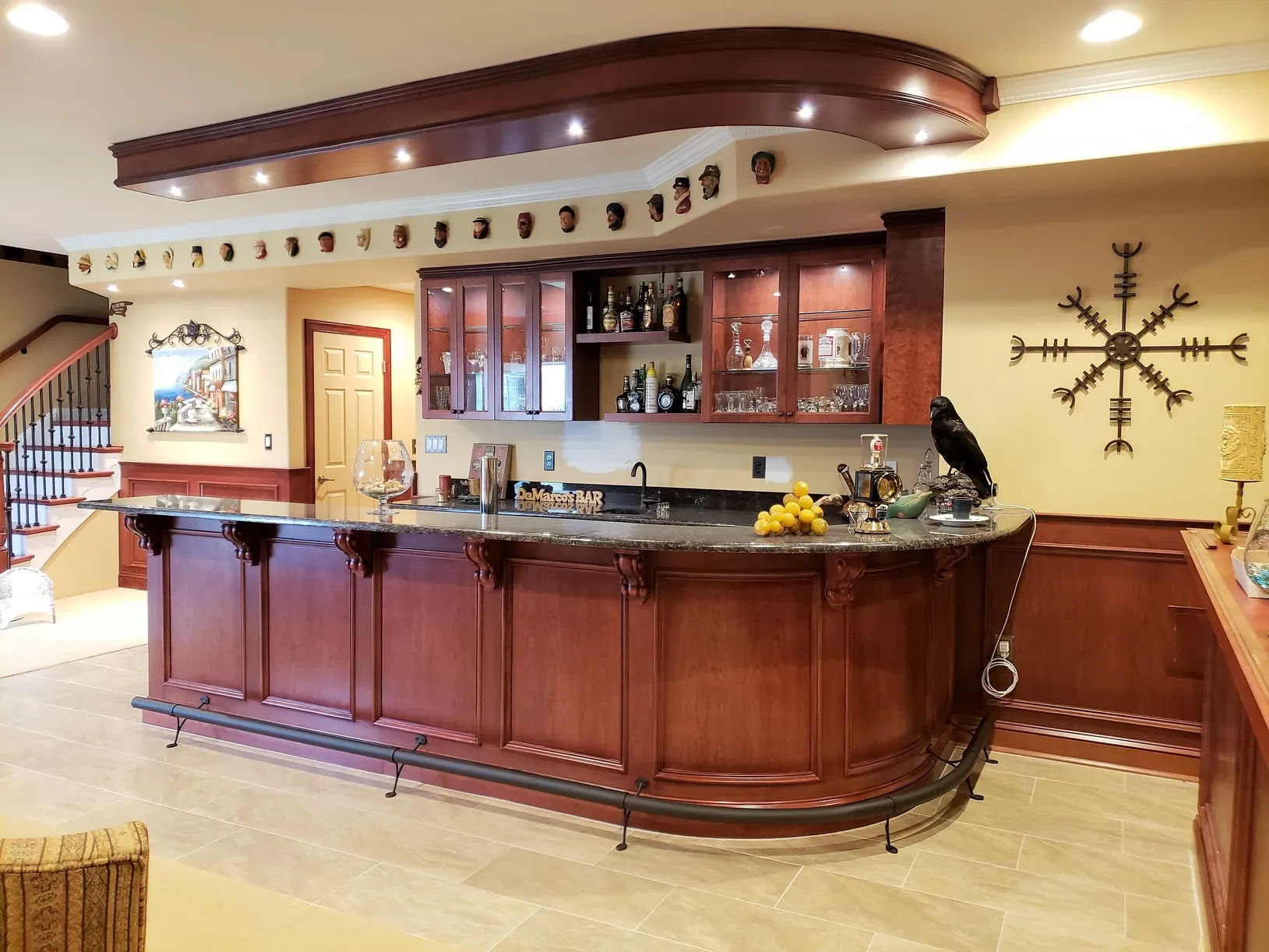 A large wooden bar with a crow on top of it