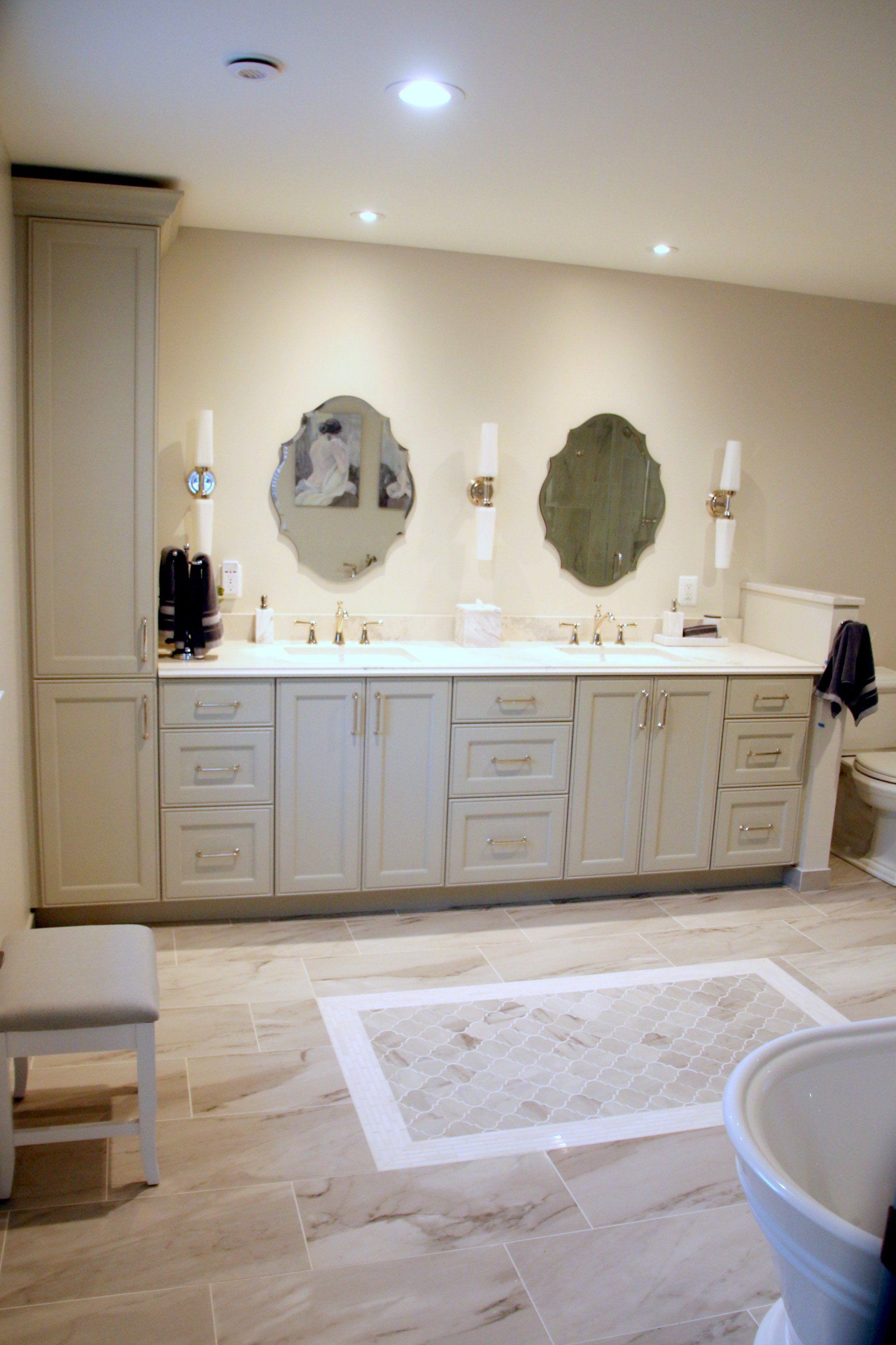 A bathroom with two sinks and two mirrors