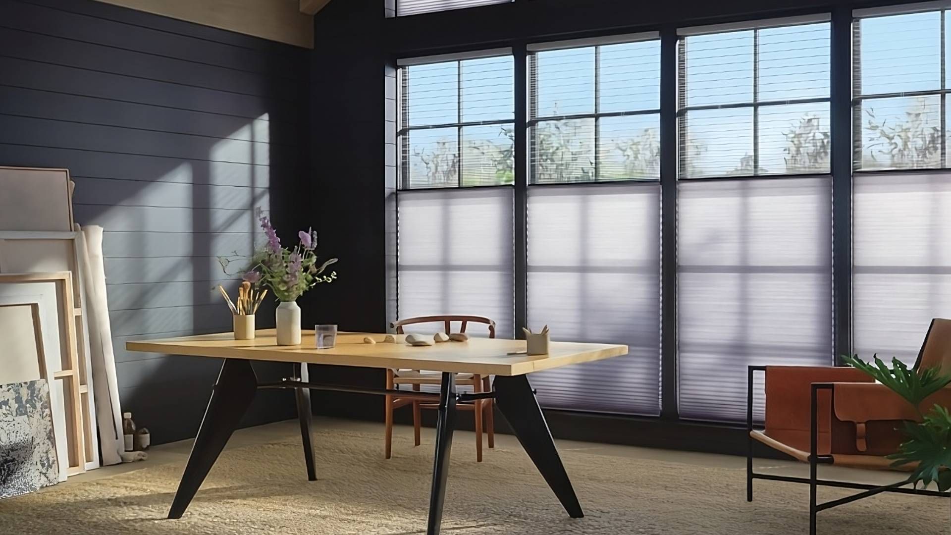 Hunter Douglas Duette® Cellular Shades providing both natural light and privacy to a moody home offi