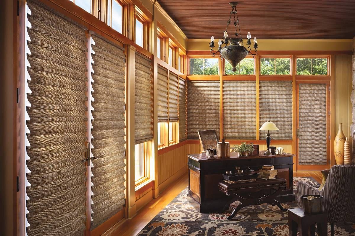 Elegant Hunter Douglas Vignette® Modern Roman Shades decorating the many windows of a home study at Divine Interiors Group near Lakewood Ranch, FL