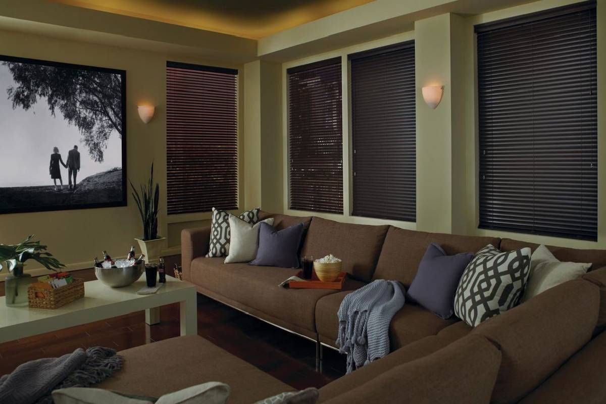 Comfortable living room with a large couch and Modern Precious Metals® Mini Blinds on the windows near Sarasota, FL