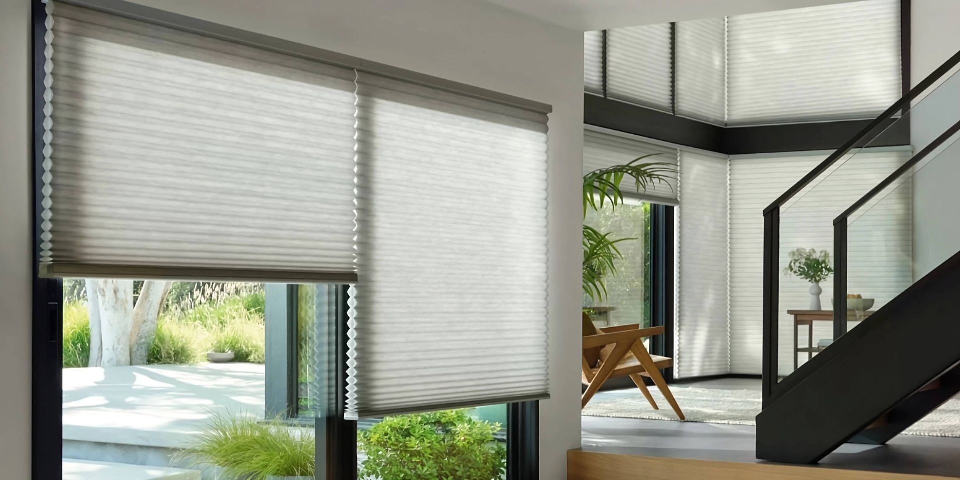 Practical and stylish Hunter Douglas cellular shades on several large windows in a contemporary home