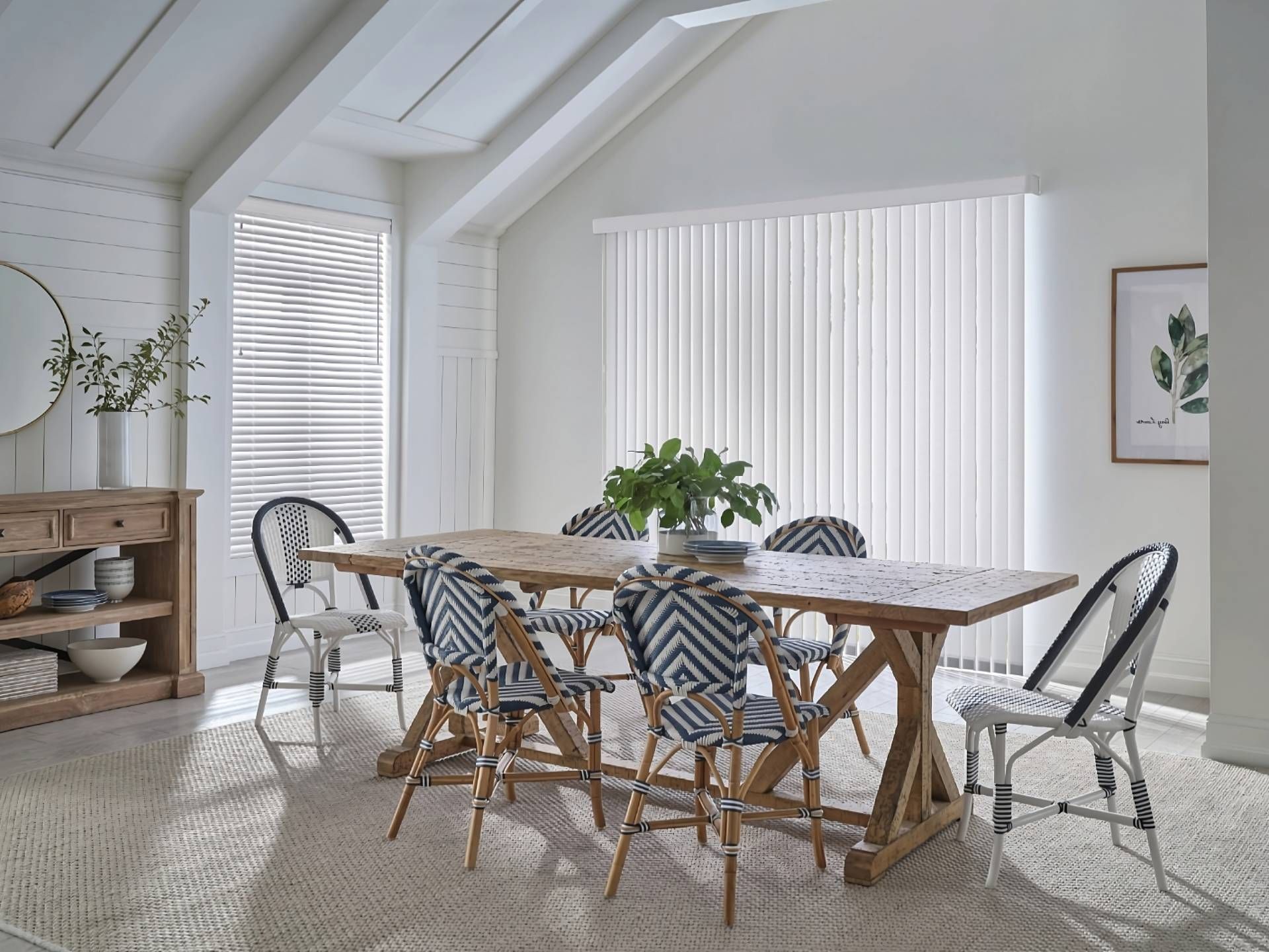 Hunter Douglas Vertical Solutions® Vertical Blinds on a sliding door in a white, minimal dining room