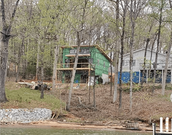 House on stilts in a wooded area
