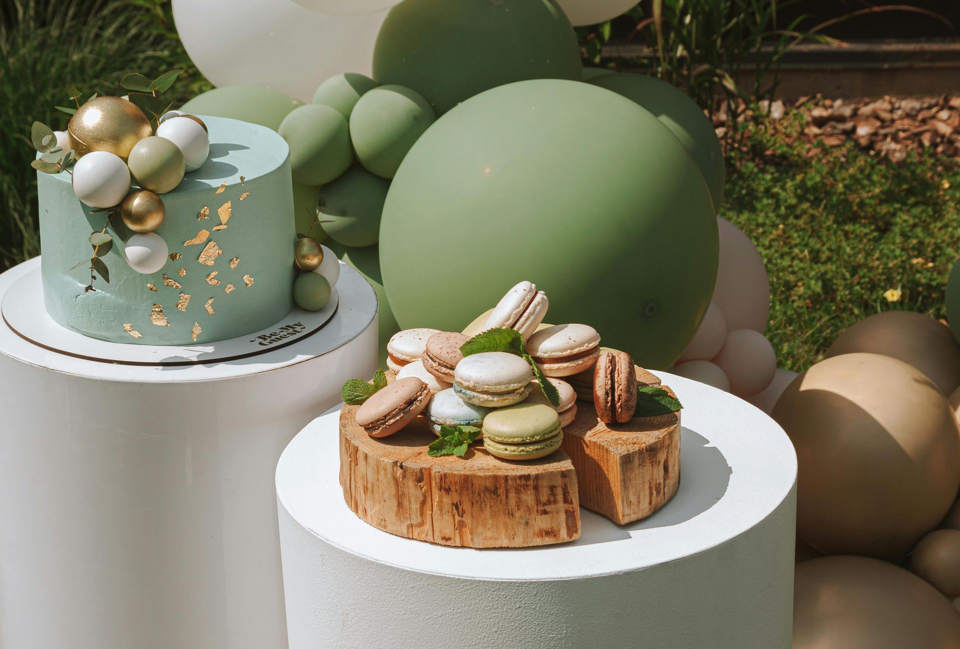 A couple of cakes sitting on top of a wooden table.