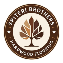 Spiteri Brothers Hardwood Flooring logo: brown circular emblem with a green stylized tree inside a light tan circle; text surrounds.
