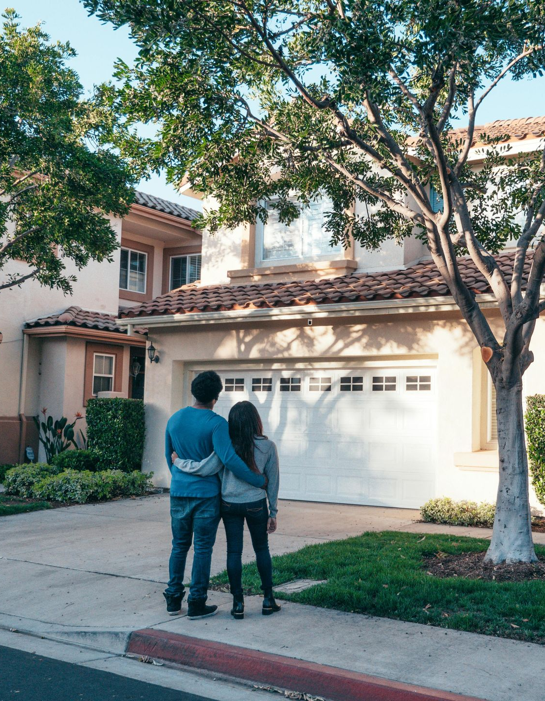 A man in a stretcher is being loaded into an ambulance