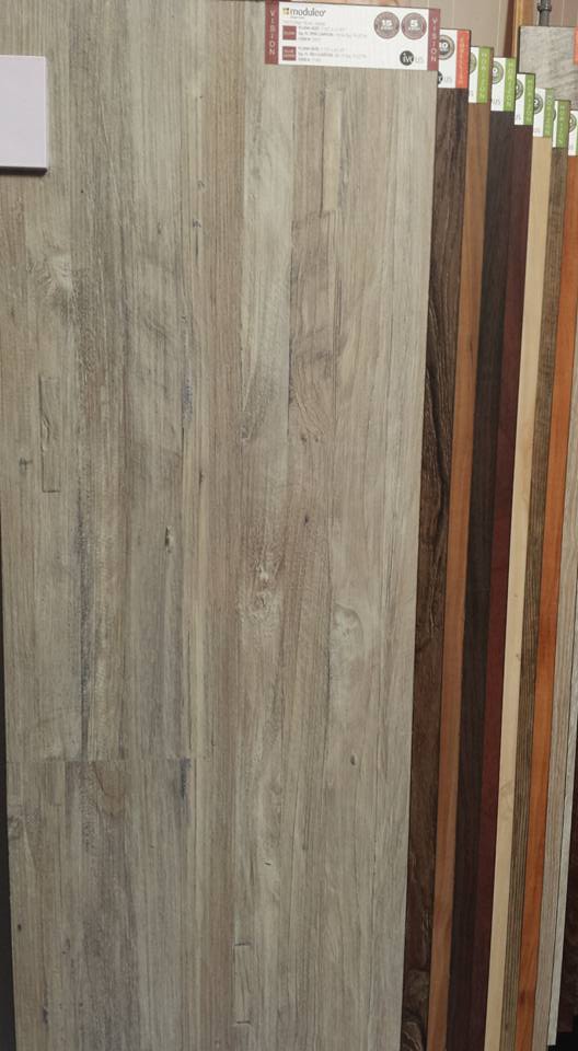 A row of wooden boards are lined up next to each other in a store.