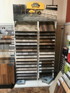 A display of different types of flooring in a store.