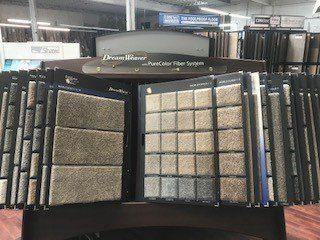 A display of carpet samples in a store.