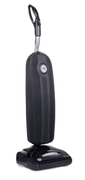 Black upright vacuum cleaner on a base, isolated on white background