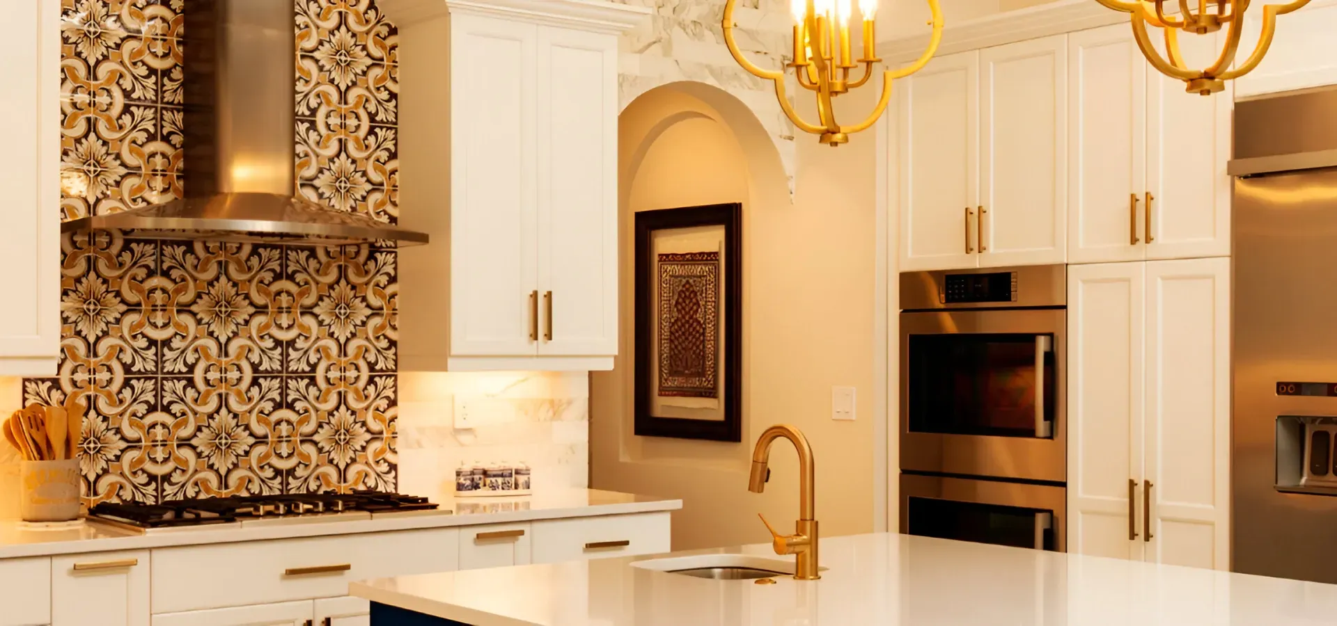 A kitchen with white cabinets and stainless steel appliances.