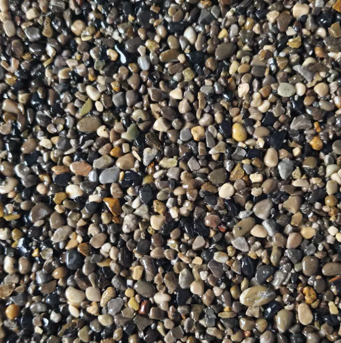 Close-up of small, smooth, multi-colored pebbles.