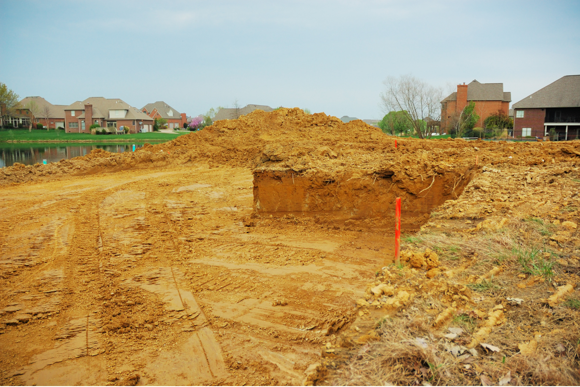 A pile of dirt is sitting in the middle of a construction site