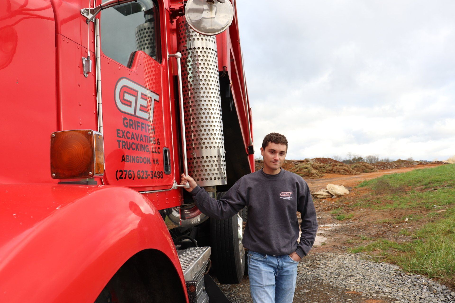 Griffith Excavating & Trucking Gallery Image - Kenworth T800 with Jared Griffith both pictured