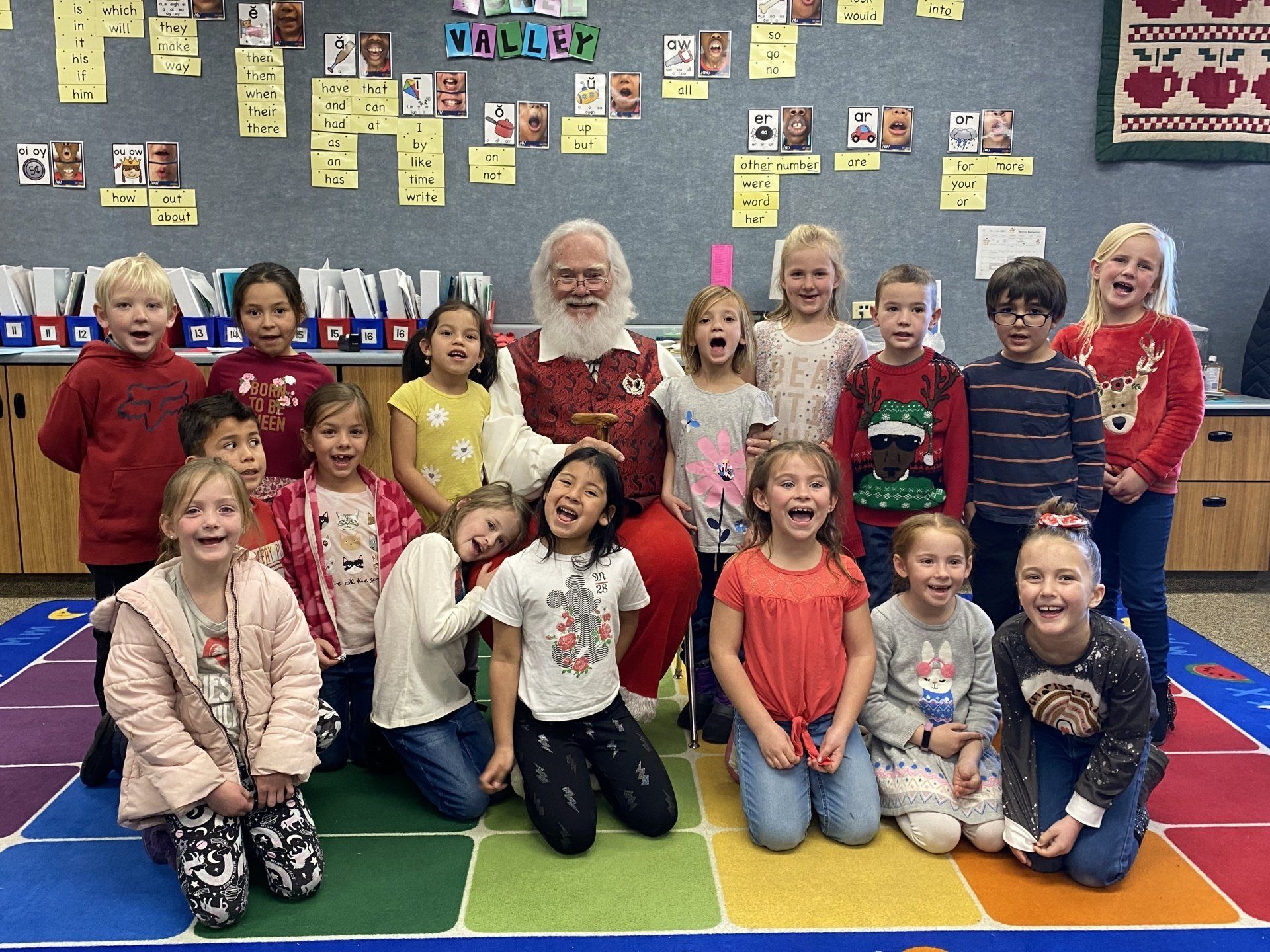 Pictures of students with Santa Claus