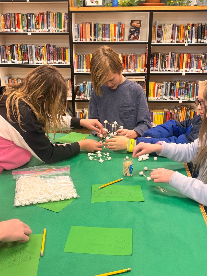 Sixth grade students build a tower with toothpicks and marshmallows.