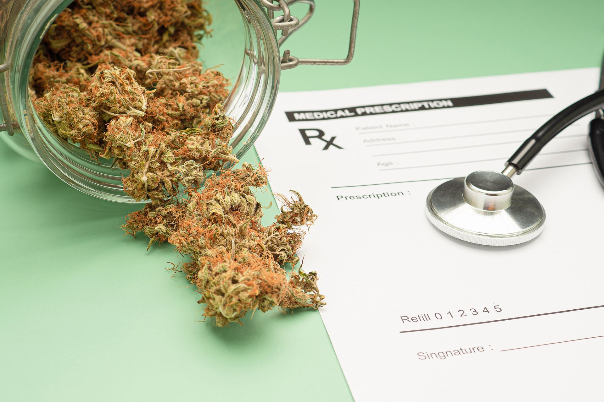 Picture of marijuana next to a medical prescription form