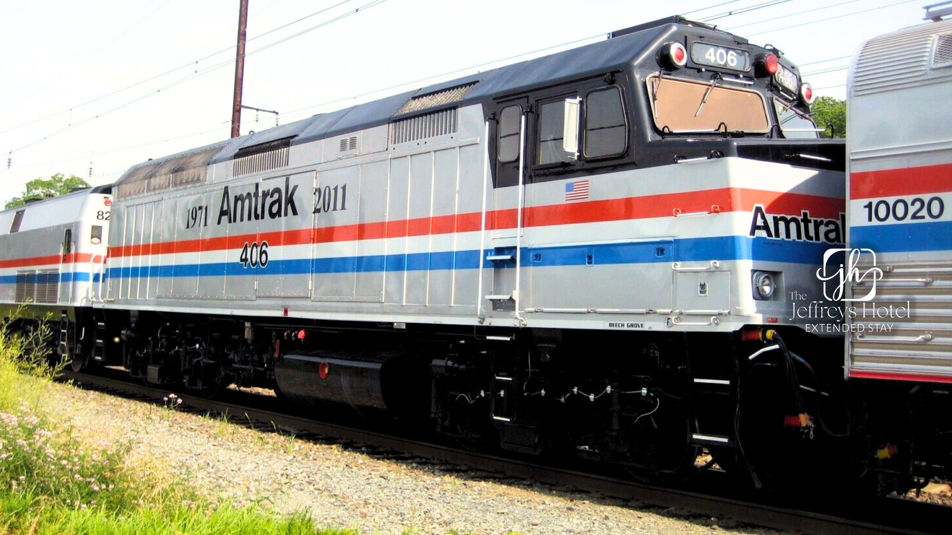 Amtrak locomotive with silver, red, and blue stripesn Osceola, Iowa